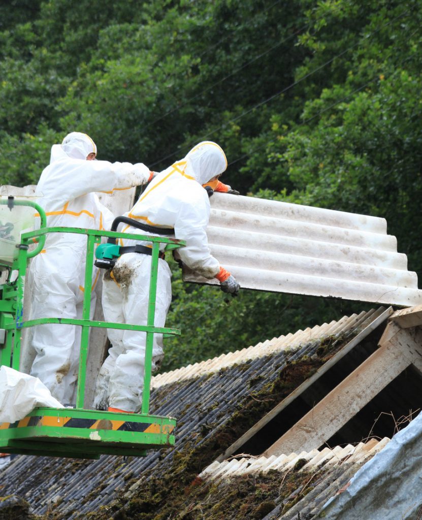 Technicians handling asbestos incident clean-up