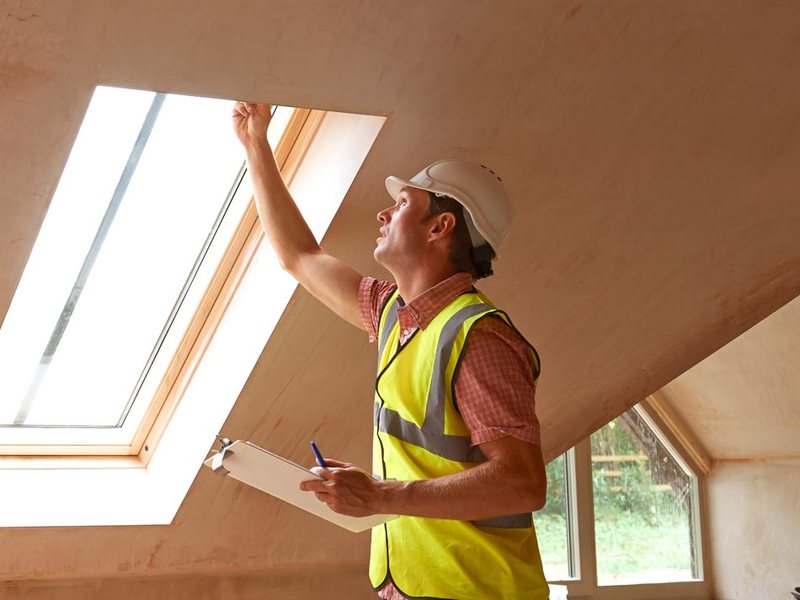 Asbestos inspector sampling building materials